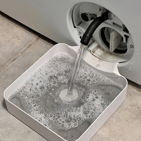 Sicora opvangbak vangt het water op dat uit het pluizenfilter van de wasmachine komt